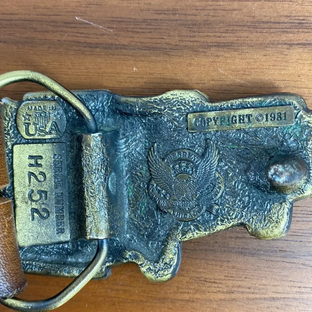 Vintage brown leather hand tooled Western belt.